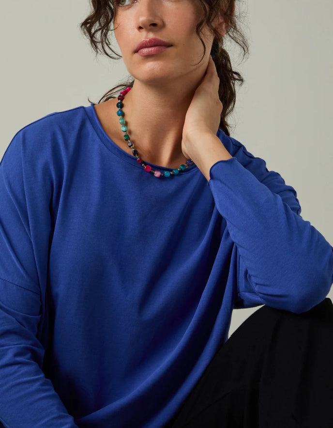 woman wearing loose fit blue t shirt