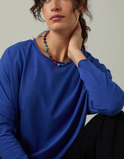 woman wearing loose fit blue t shirt