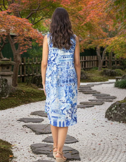 woman wearing a reversible sleeveless shift dress in an outdoor Japanese setting