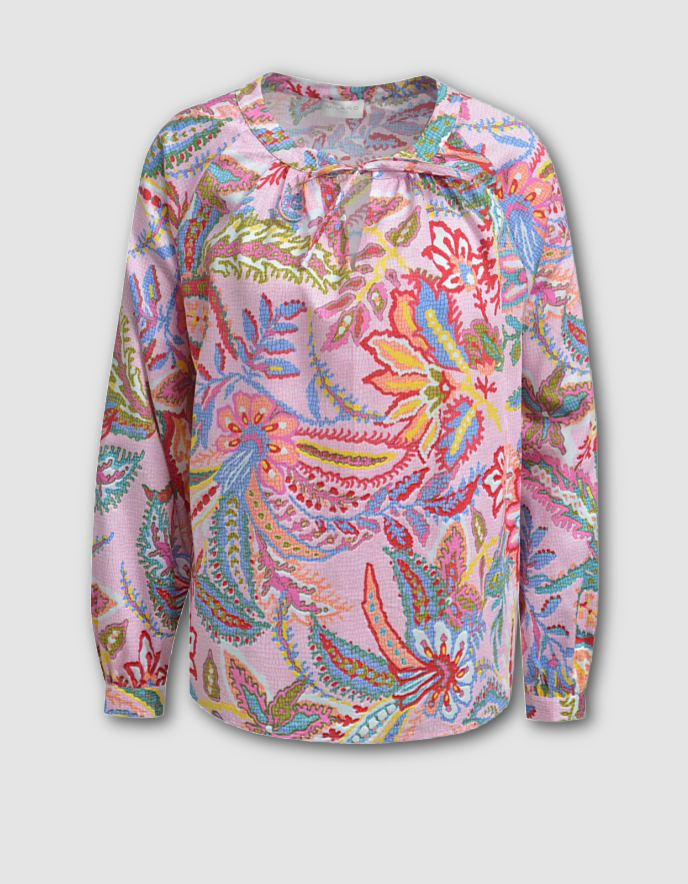 Colorful floral patterned shirt on a light gray background