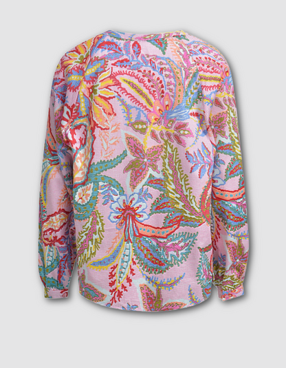Colorful floral patterned shirt on a light gray background