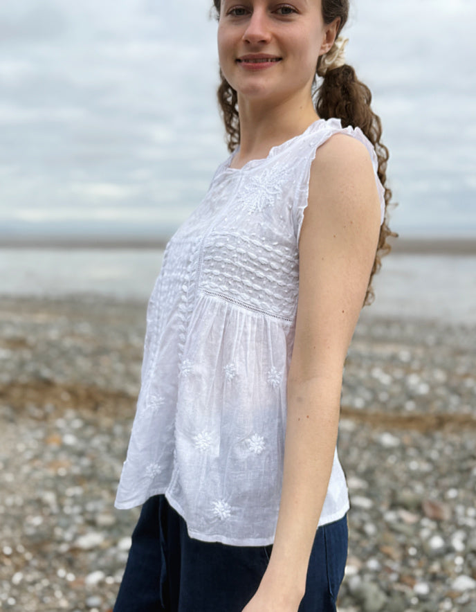 white cotton sleeveless embroidered top