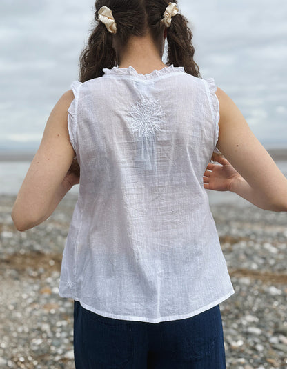white cotton sleeveless embroidered top