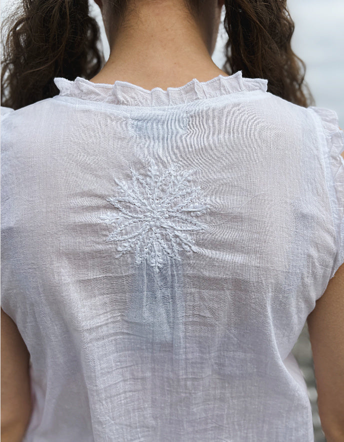 white cotton sleeveless embroidered top