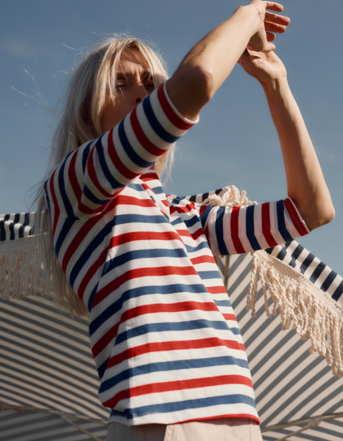 woman wearing striped red white and blue Breton striped cotton t shirt