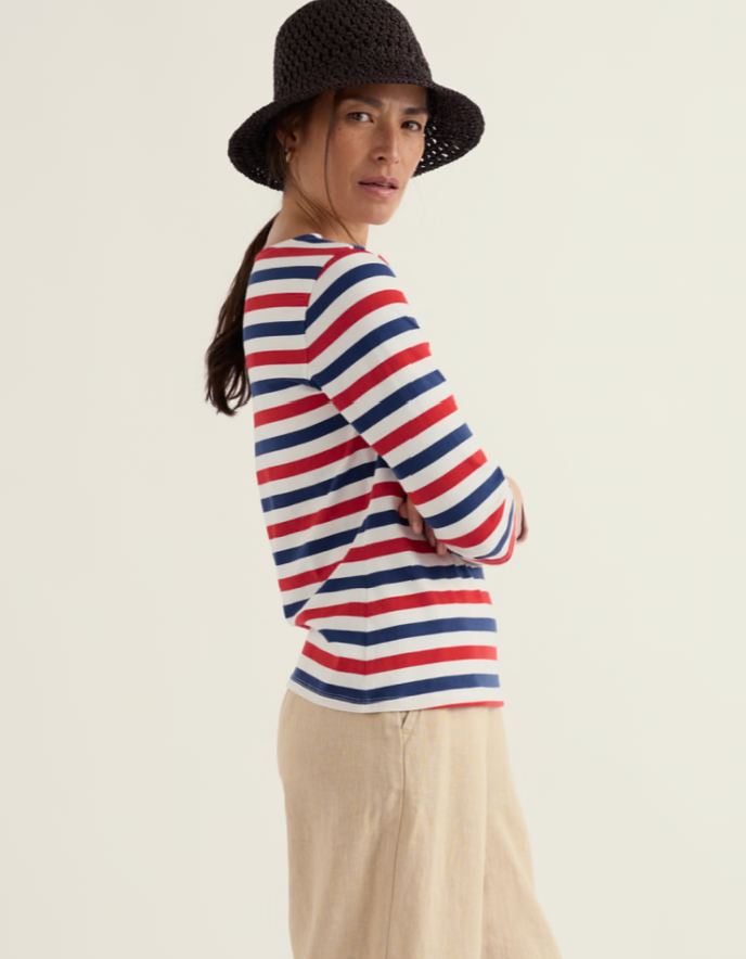 woman wearing striped red white and blue Breton striped cotton t shirt
