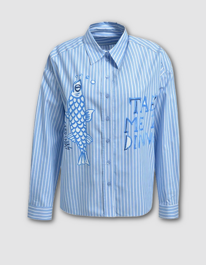 Blue striped shirt with fish design and text on a gray background