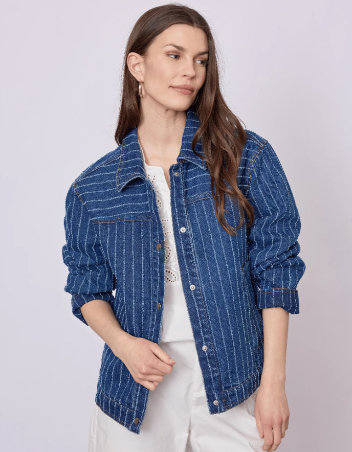Woman wearing a blue striped jacket on a white background