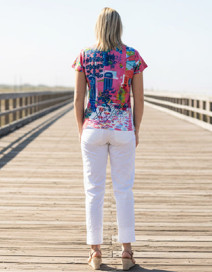 woman wearing pink cotton t shirt with scooter print