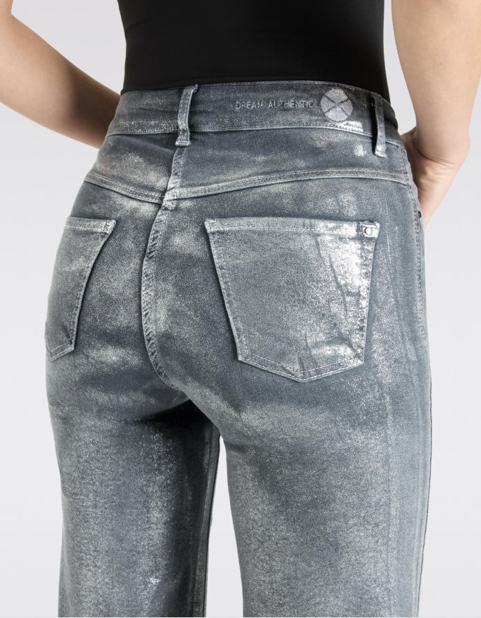 Gray acid-wash jeans being worn on a plain background