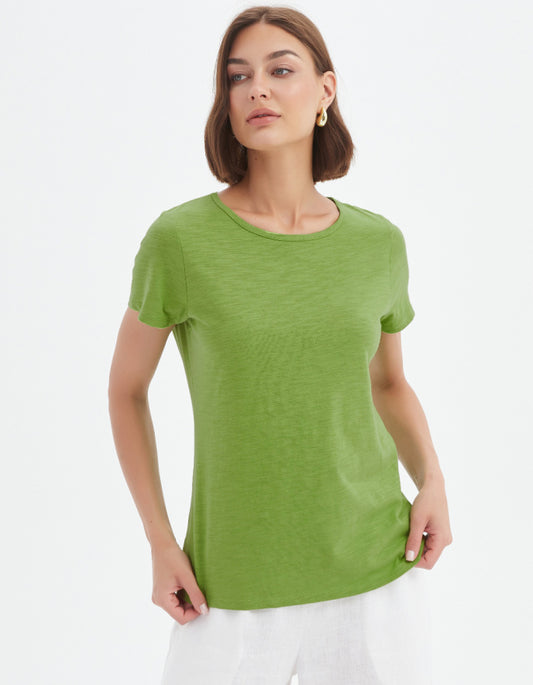 Woman wearing a green t-shirt against a white background