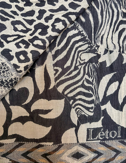 Textile with leopard, zebra, and geometric patterns featuring the brand 'Létol'.