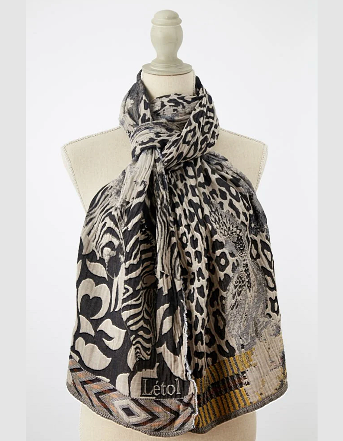 Leopard print scarf on a mannequin with 'L etol' branding against a white background