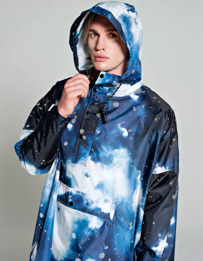 one size waterproof poncho with hood and large kangaroo pocket featuring a starry night print in blue and greys with reflective stars