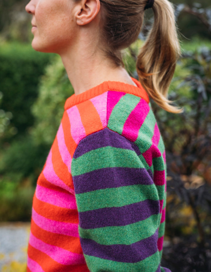 reversible wool crew necked striped sweater in pink, green orange and purple 