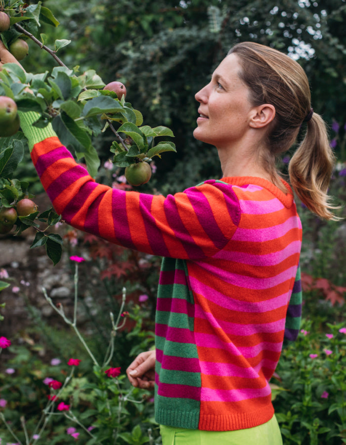 reversible wool crew necked striped sweater in pink, green orange and purple 