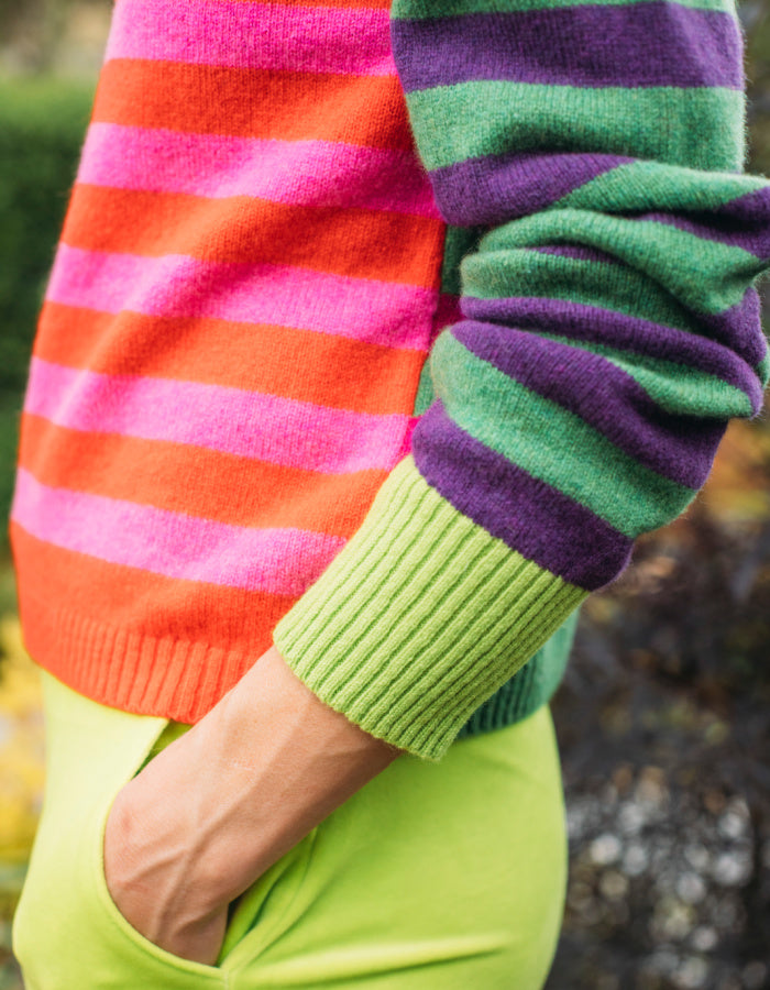 reversible wool crew necked striped sweater in pink, green orange and purple 