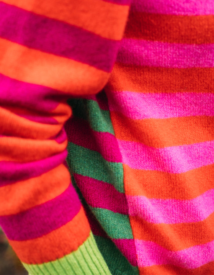 reversible wool crew necked striped sweater in pink, green orange and purple 