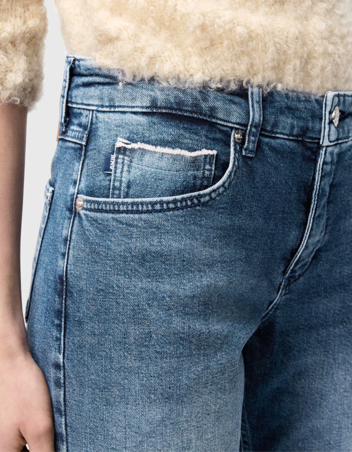 Close-up of blue jeans with a blurred background