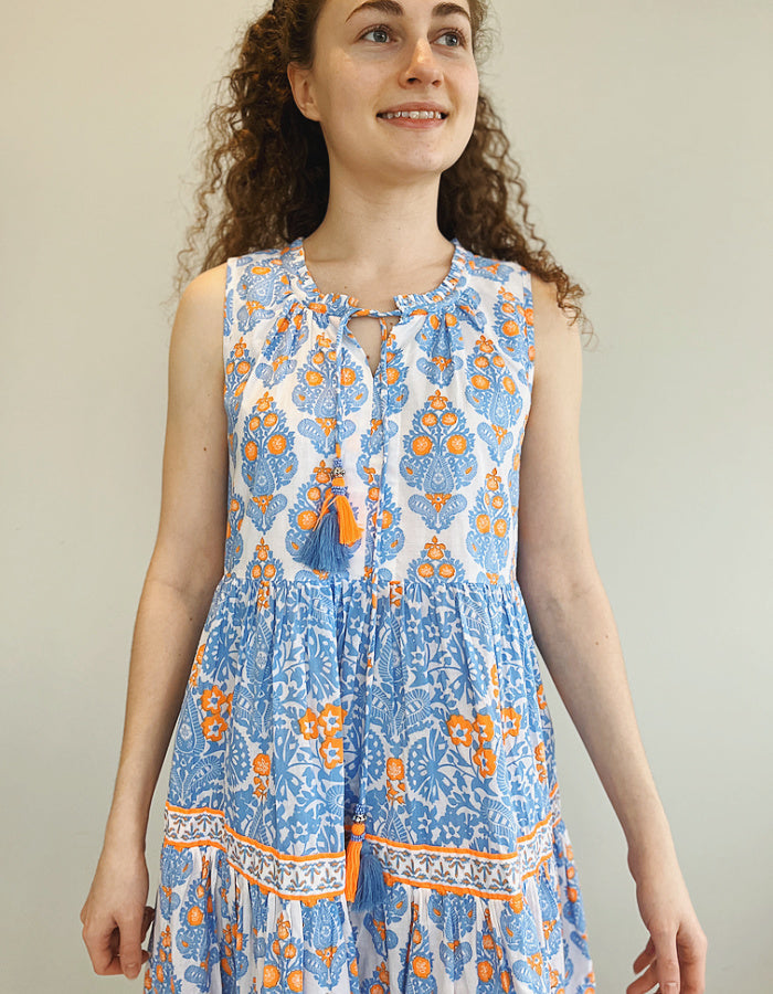 tiered sleeveless summer cotton midi length dress in sky blue and neon orange print