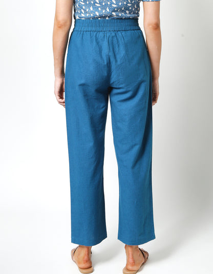 teal linen summer trousers with two front patch pocket and elasticated waist
