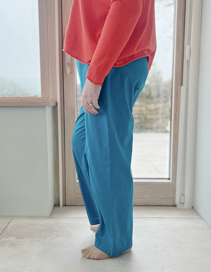 teal linen summer trousers with two front patch pocket and elasticated waist