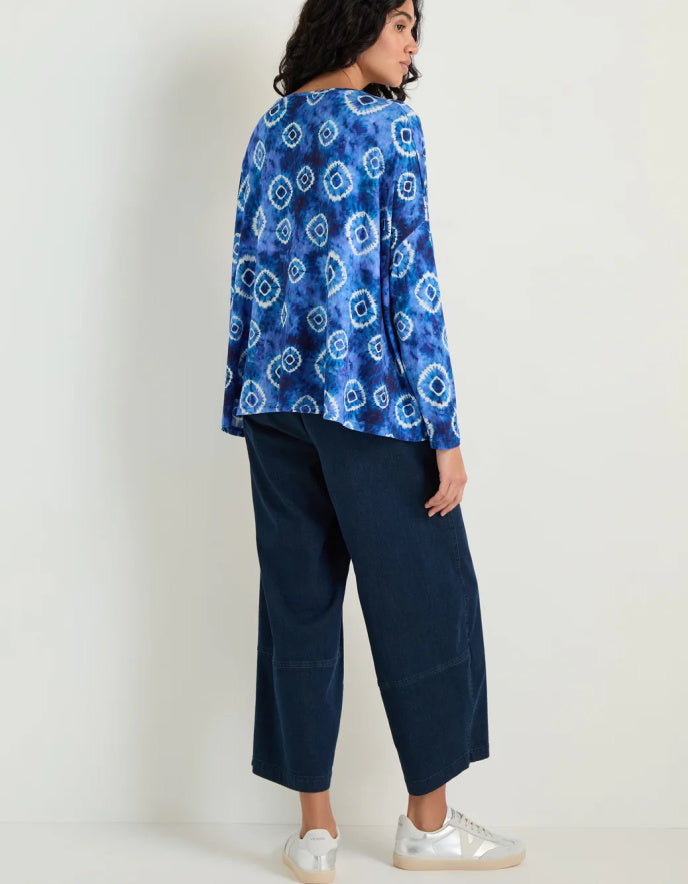 woman wearing tie dye blue and white loose fit jersey top