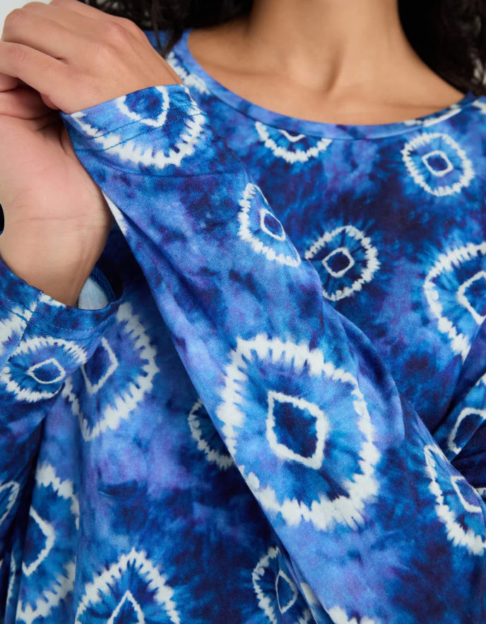 woman wearing tie dye blue and white loose fit jersey top