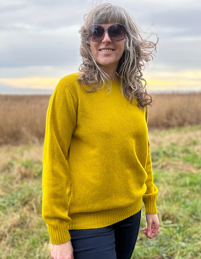 woman wearing yellow wool jumper