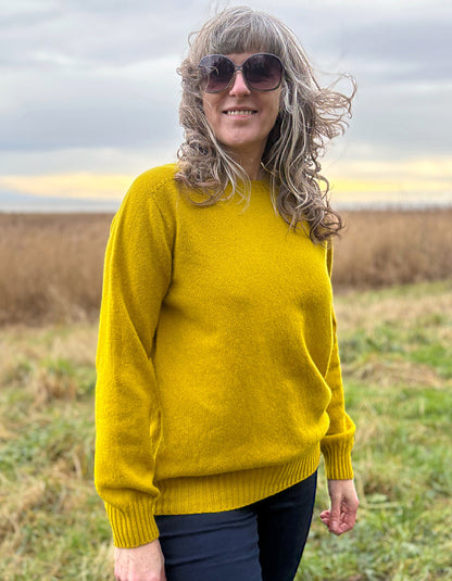 woman wearing yellow wool jumper