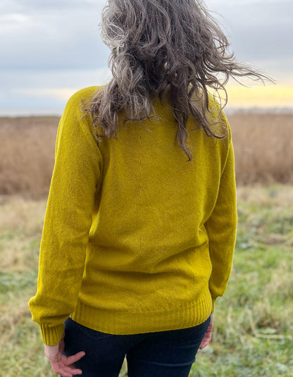 woman wearing yellow wool jumper