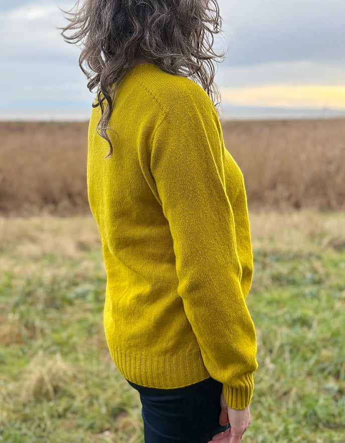 woman wearing yellow wool jumper