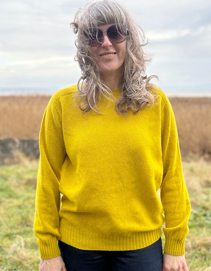 woman wearing yellow wool jumper