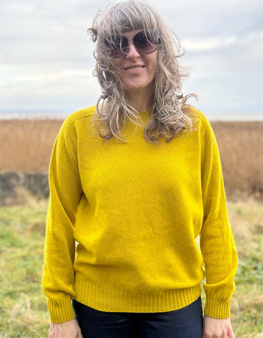 woman wearing yellow wool jumper