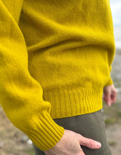 woman wearing yellow wool jumper