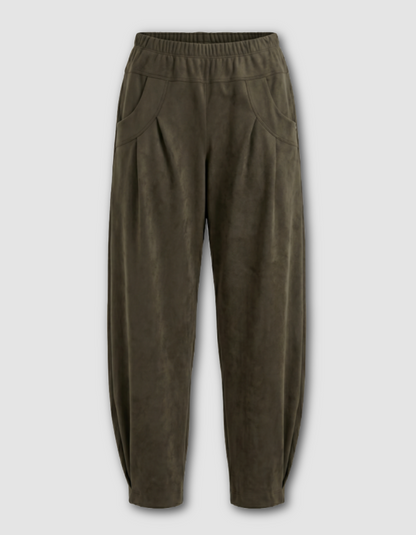 Olive green wide-leg pants with a textured suede-like finish, elastic waistband, and side pockets, shown against a light gray background.