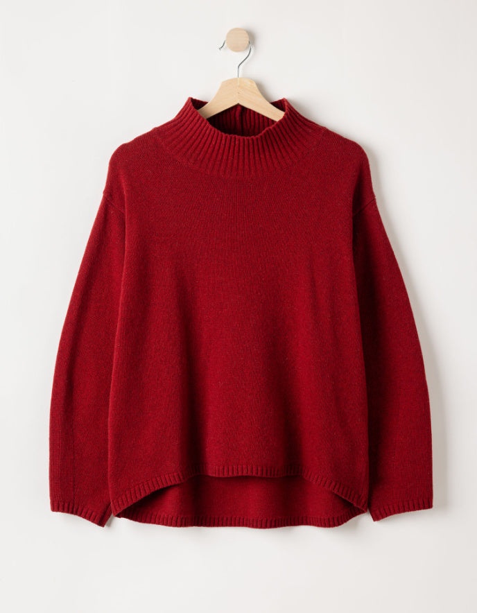  a red wool turtle neck sweater against a white background