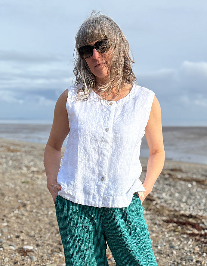 woman wearing white linen waistcoat