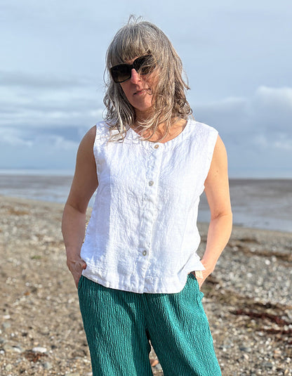 woman wearing white linen waistcoat