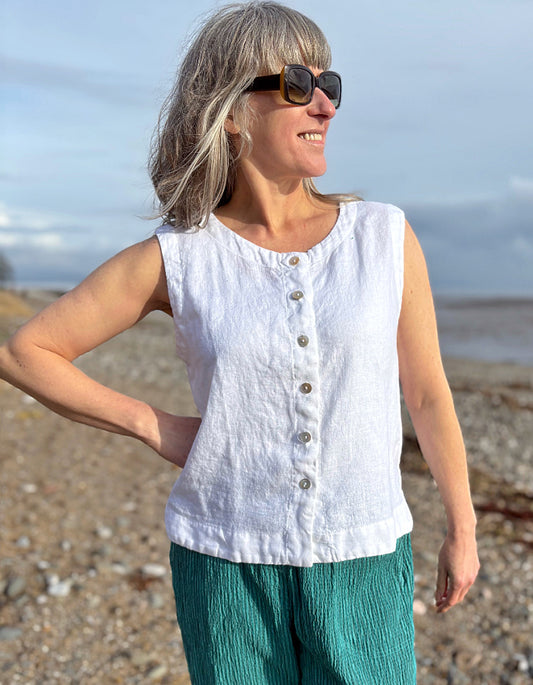 woman wearing white linen waistcoat