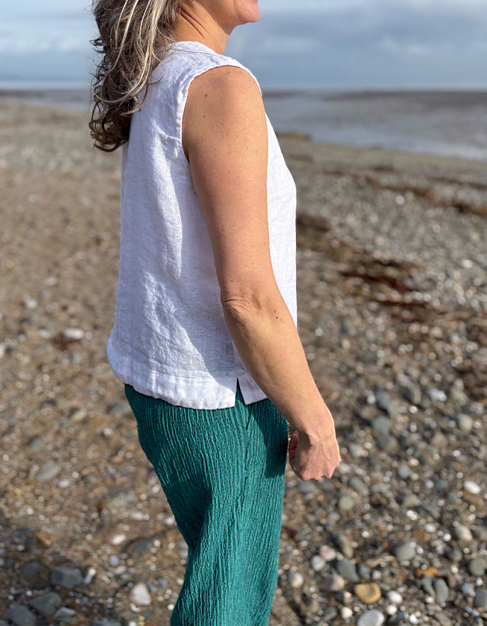 woman wearing white linen waistcoat