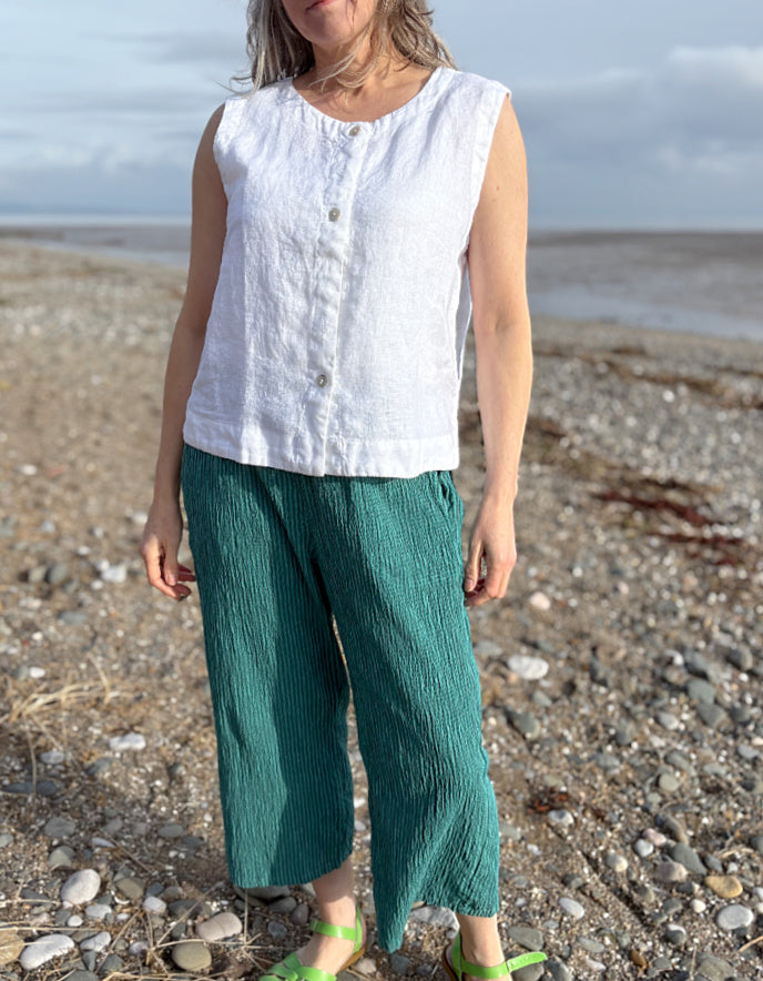 woman wearing white linen waistcoat