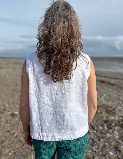 woman wearing white linen waistcoat