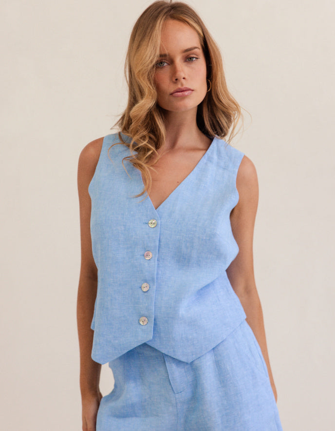woman wearing chambray blue linen waistcoat