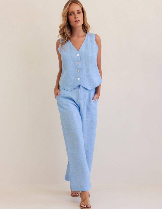 woman wearing chambray blue linen waistcoat