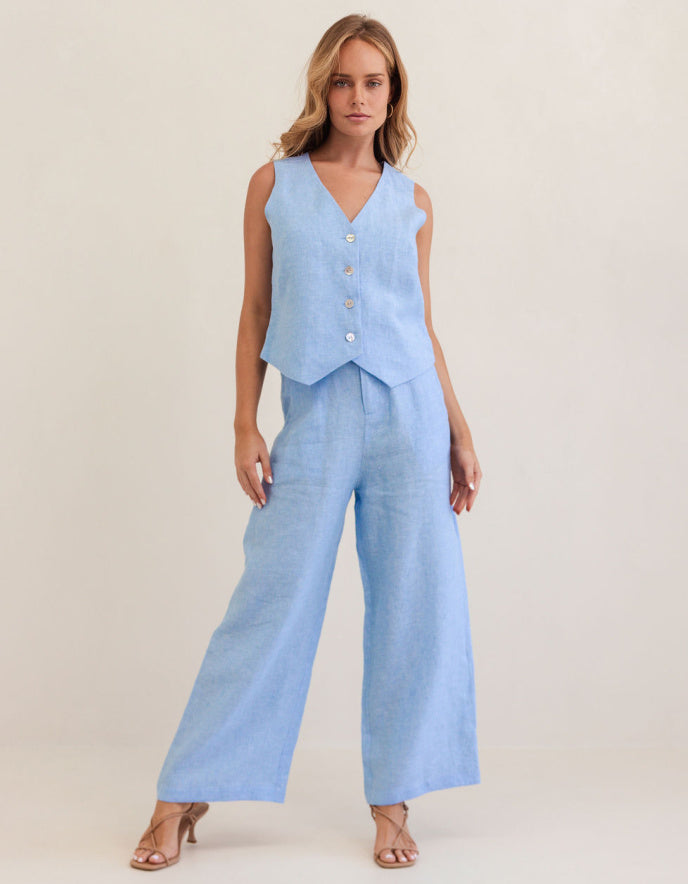 woman wearing chambray blue linen waistcoat