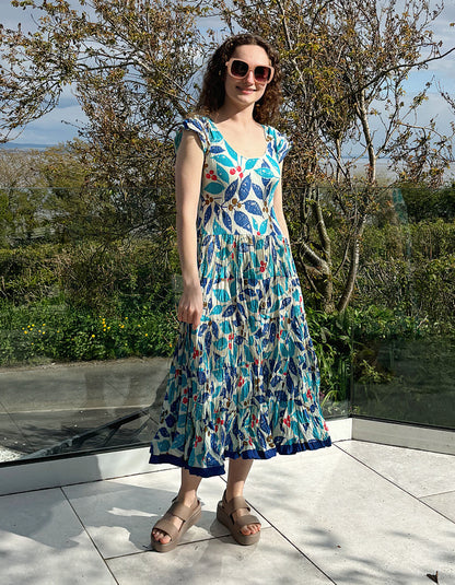 turquoise, blue and red hand block print cotton summer dress with scoop neck and capped sleeves and a full skirt