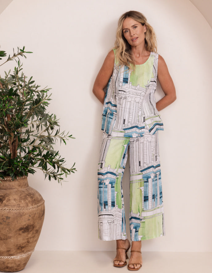 woman wearing linen coord trouser snd top with Rome print