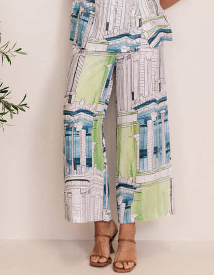 woman wearing linen coord trouser snd top with Rome print