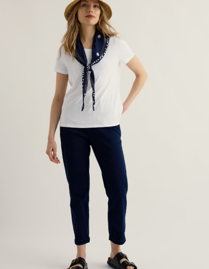 woman wearing organic white cotton t shirt short sleeves and a scoop neckline